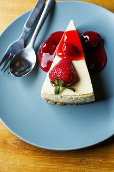 Top view of Strawberry Cheesecake with spoon and fork