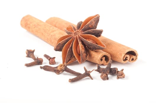 Cinnamon sticks, Anise and Cloves Isolated On White