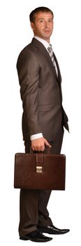 Standing businessman with briefcase. Isolated on the white background.
