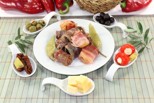 different tapas in Serving spoon on a wooden mat