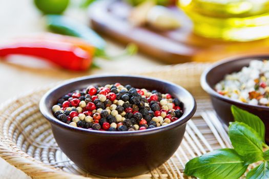 Colourful dried pepper in a wood bowl