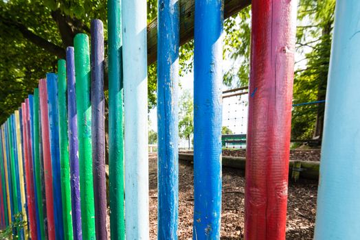 kindergarten playground area surrounded by a fence in vivid colors