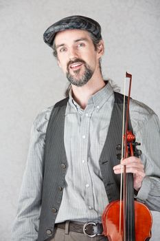 One cheerful Irish fiddler with violin and bow