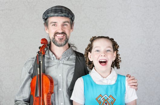 Singing girl with curls with Irish folk performer