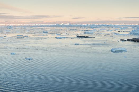 Arctic landscape in Greenland around Ilulissat with mountains and icebergs