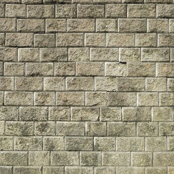 Stone brick wall with  weathered cement  background