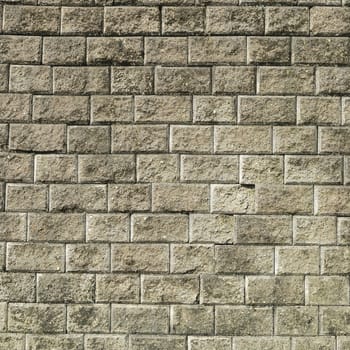 Stone brick wall with  weathered cement  background