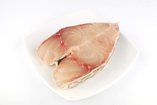 Fresh uncooked red fish meat fillet on white background