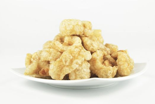 Pork rinds also known as chicharon or chicharrones, deep fried pork skin