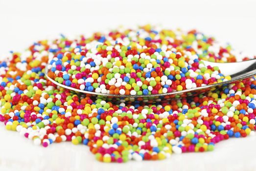 Colorful candy confetti on the white background