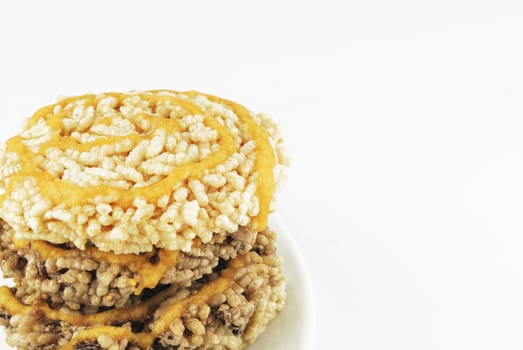 raw Thai ancient dessert made from streamed sticky rice pressed in circle mold dried with sun and fried in hot oil