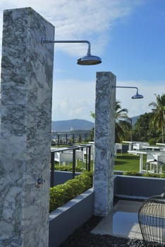 Outdoor shower at swimming pool and beach. The place you get clean after a nice day on the beach.