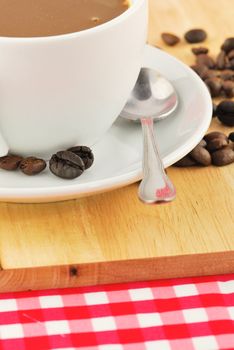 Coffee beans and coffee mug