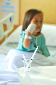 Sick little girl in hospital bed