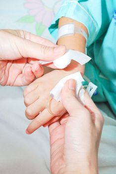 Hand of sick little girl at hospital