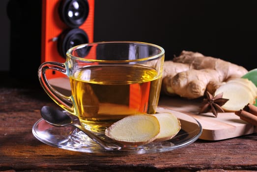 Ginger tea on wood table backdrop