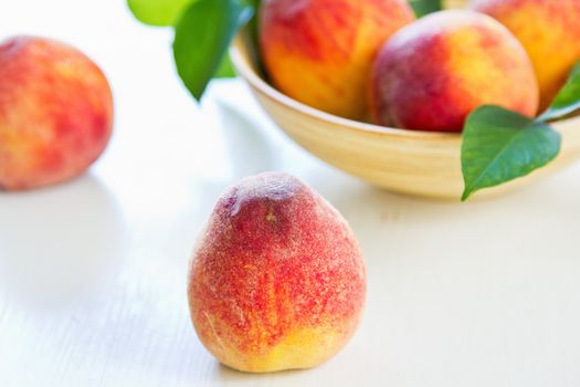 Fresh Peachs in a wood bowl