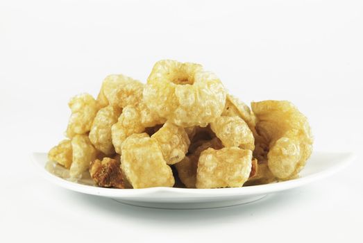 Pork rinds also known as chicharon or chicharrones, deep fried pork skin