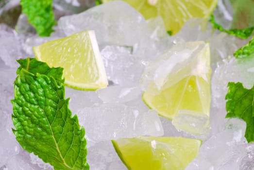 Mojito , lime pieces , leaves of mint with ice and rum