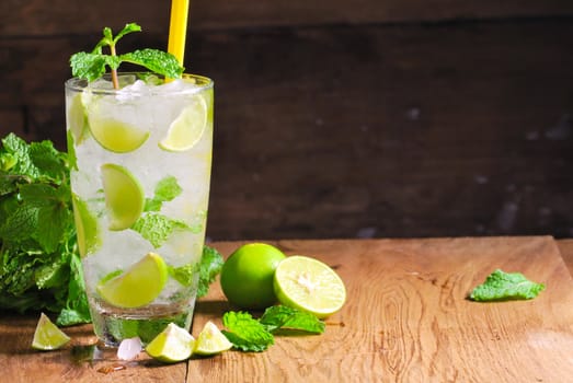 Mojito , lime pieces , leaves of mint with ice and rum