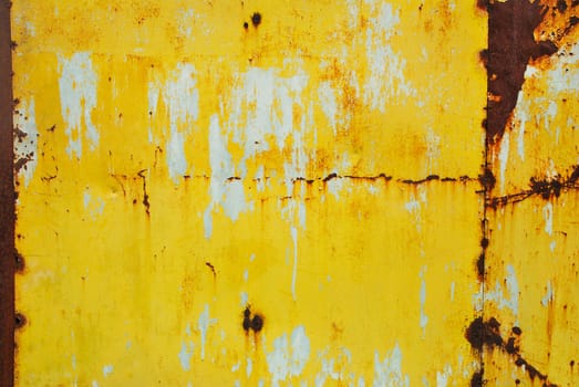 Yellow painted metal with rust texture