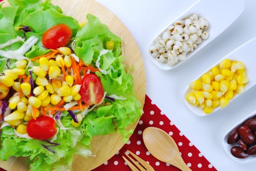 Fresh vegetable salad with corn,carrot,tomato,green oak,red oak,Red bean and millet