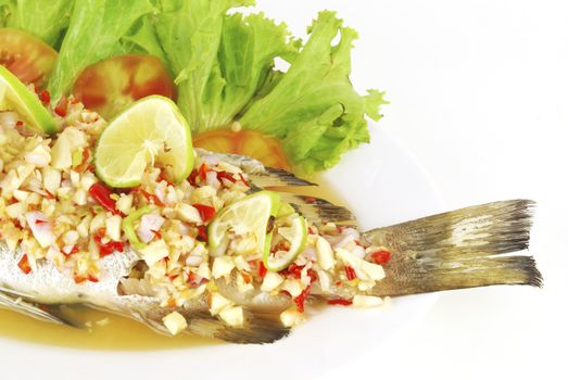 steamed sea bass with red chili / ingredient include garlic,ginger and light soy sauce.