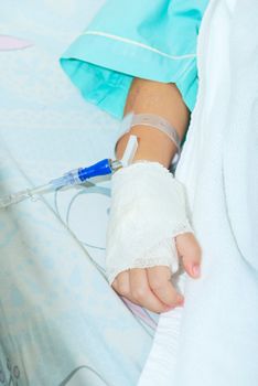 Hand of sick little girl at hospital