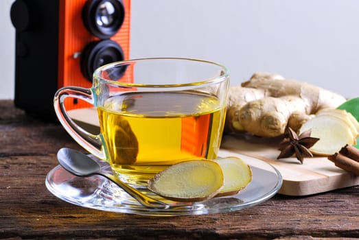 Ginger tea on wood table backdrop