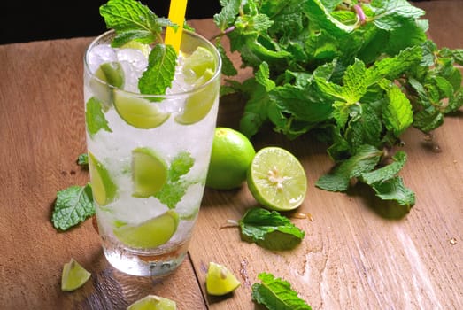 Mojito , lime pieces , leaves of mint with ice and rum