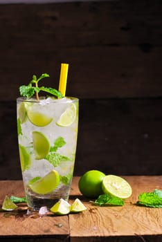 Mojito , lime pieces , leaves of mint with ice and rum