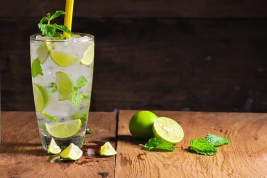 Mojito , lime pieces , leaves of mint with ice and rum