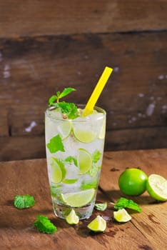 Mojito , lime pieces , leaves of mint with ice and rum