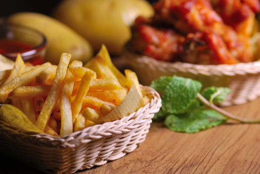 fried chicken wings with french fries and ketchup