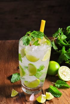 Mojito , lime pieces , leaves of mint with ice and rum