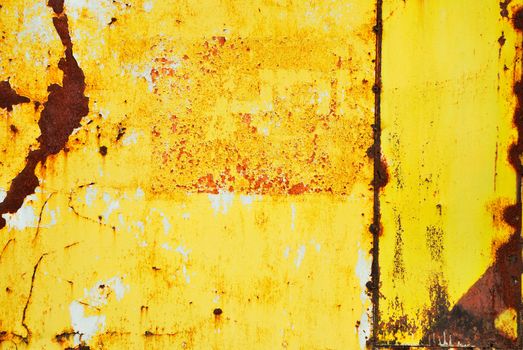 Yellow painted metal with rust texture