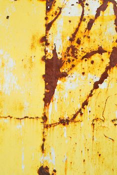 Yellow painted metal with rust texture