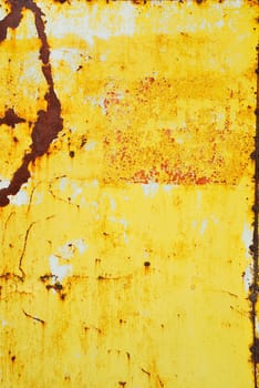Yellow painted metal with rust texture