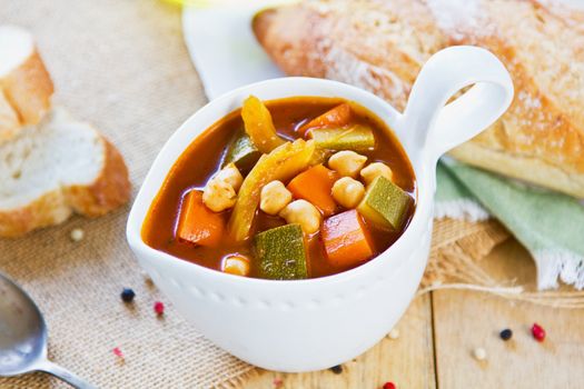 Vegetables with Chickpea soup by loaf of bread