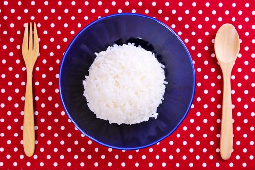 Thai jasmine cooked rice on blue plate