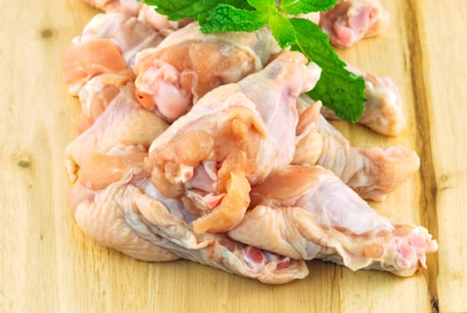 Chicken wing meat on chop board