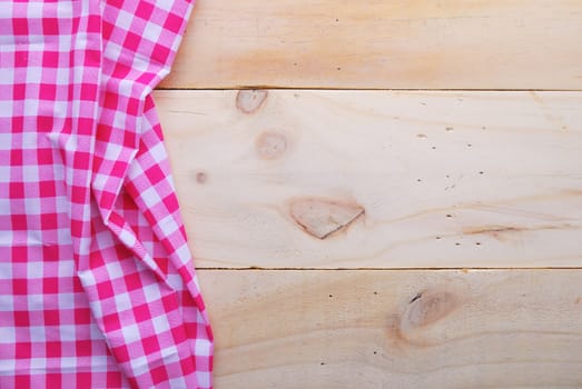 the background made from tablecloth on wooden table