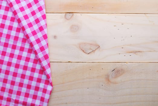 the background made from tablecloth on wooden table