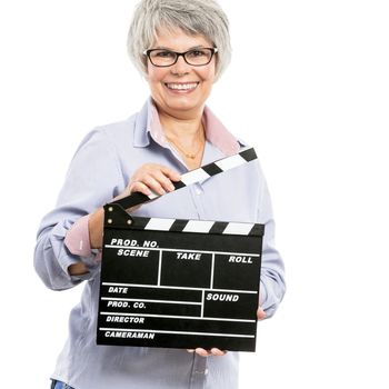 Happy elderly woman holding a clapboard, isolated on white background