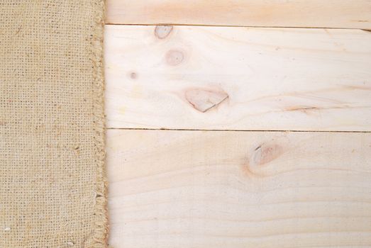 Gunny sack texture and wood plank table background