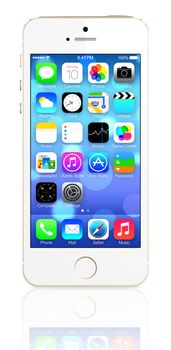 Galati, Romania - August 12, 2014: Gold iPhone 5s showing the home screen with iOS7. Some of the new features of the iPhone 5s include fingerprint recognition built into the home button, a new camera, and a 64-bit processor. Apple released the iPhone 5s on September 20, 2013.