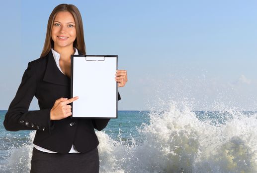 Businesswoman holding paper holder. Splashes of sea waves as backdrop