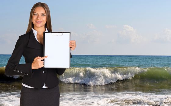 Businesswoman holding paper holder. Splashes of sea waves as backdrop