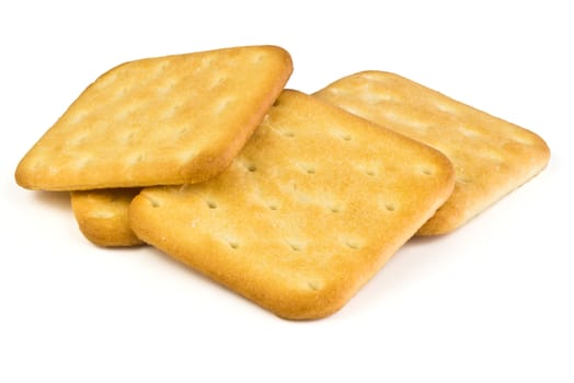 Four square plate of salty crackers isolated on white background