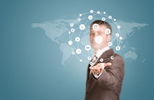 World map with app icons. Businessman in a suit as backdrop